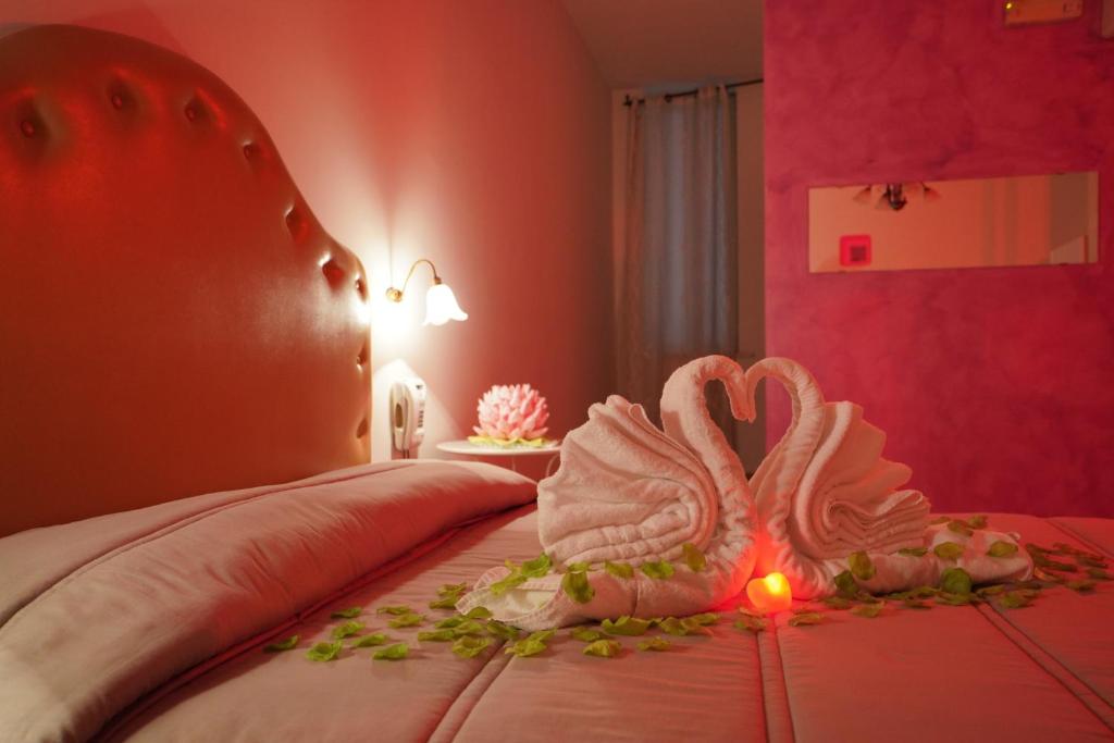 Postel nebo postele na pokoji v ubytování Hotel Stefany