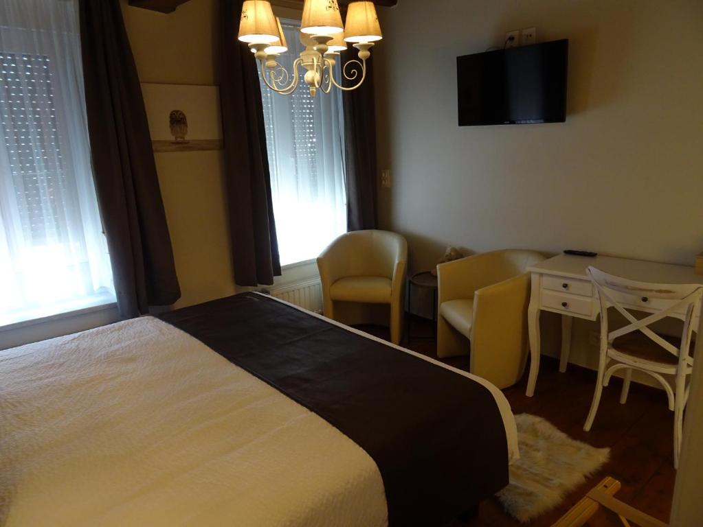 Postel nebo postele na pokoji v ubytování D'Hommelbelle