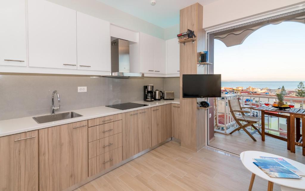 Kuchyň nebo kuchyňský kout v ubytování Eolia Apartment