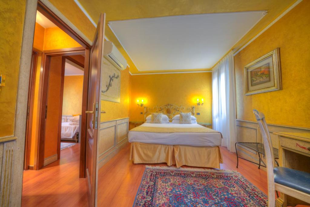 Postel nebo postele na pokoji v ubytování Hotel Al Piave