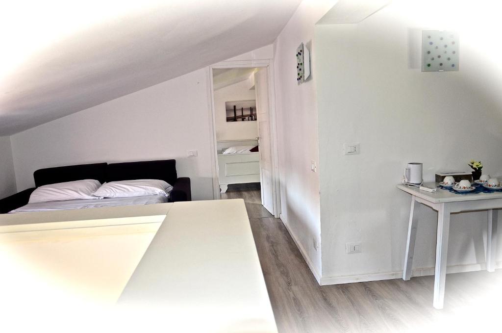 Łóżko lub łóżka w pokoju w obiekcie Corte del Garda Home