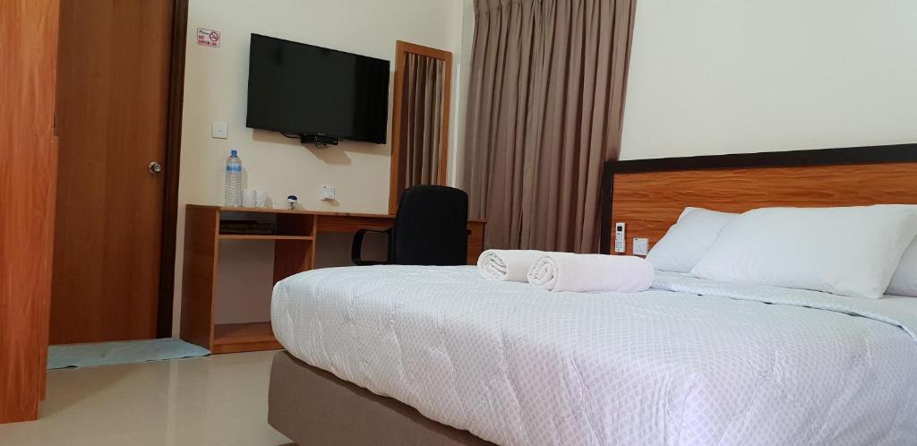 Postel nebo postele na pokoji v ubytování Hulhan'gu Lodge