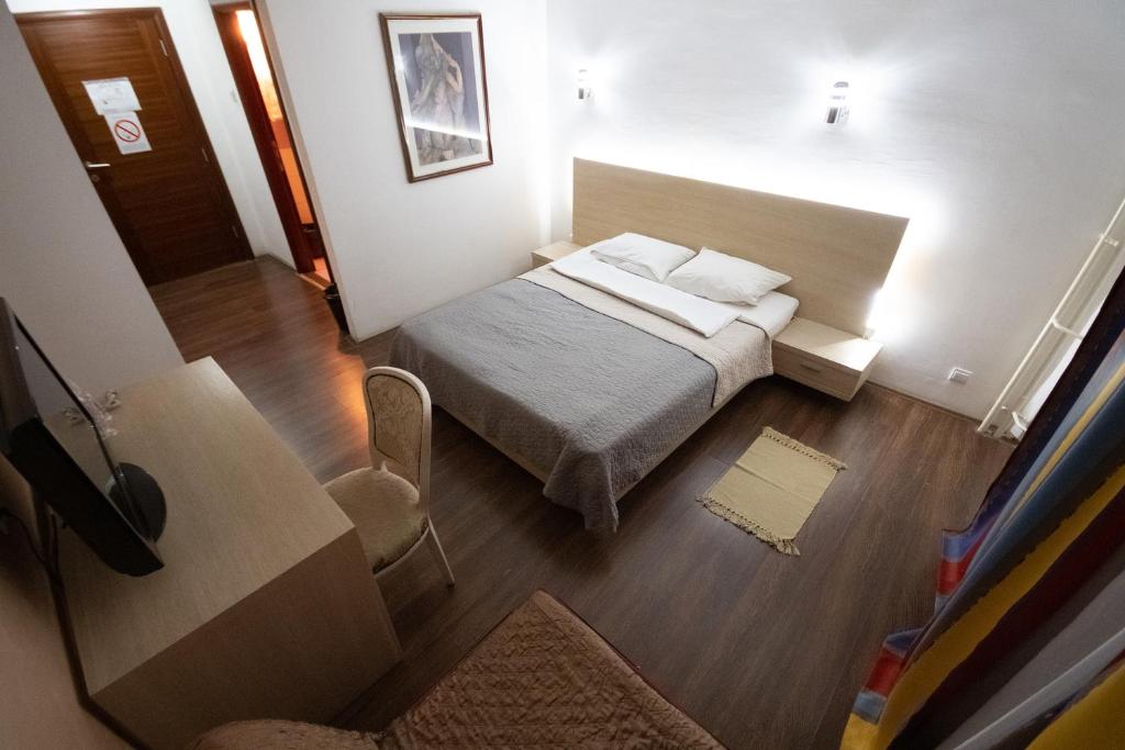 Postel nebo postele na pokoji v ubytování Hotel Dunav Požarevac