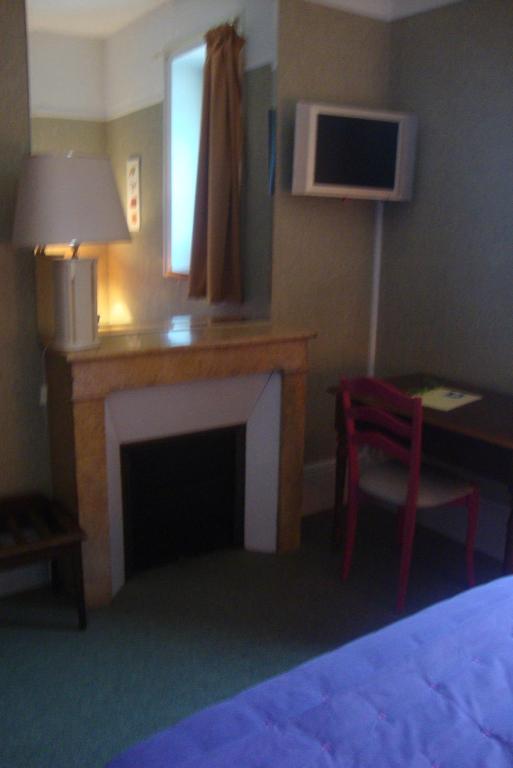 TV a/nebo společenská místnost v ubytování Hotel LE BEAU SITE