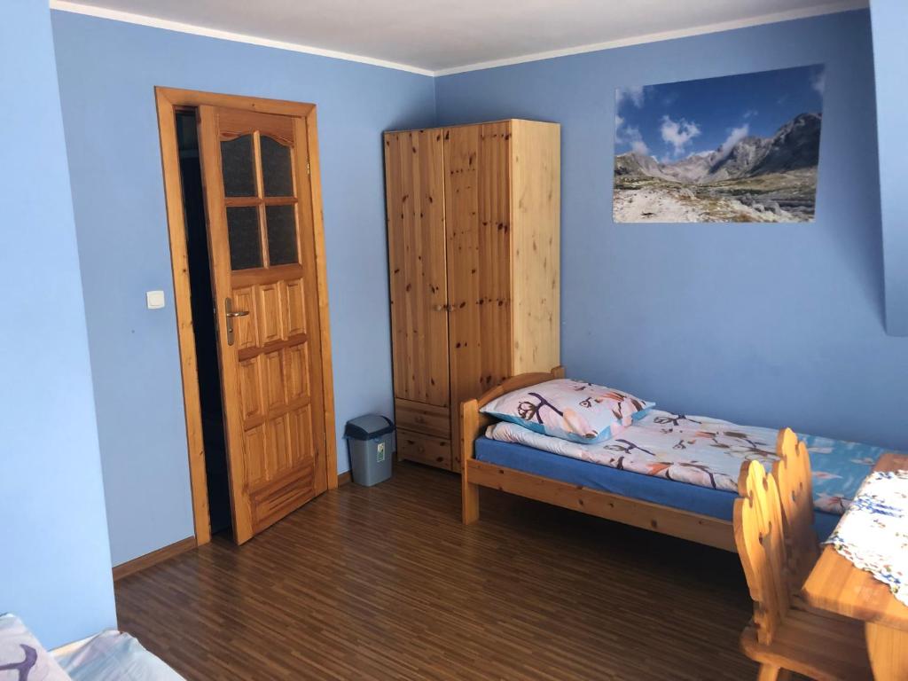 Posteľ alebo postele v izbe v ubytovaní Pokoje Gościnne Pod Gubałówką
