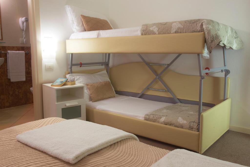 Postel nebo postele na pokoji v ubytování Hotel Villa Anthea