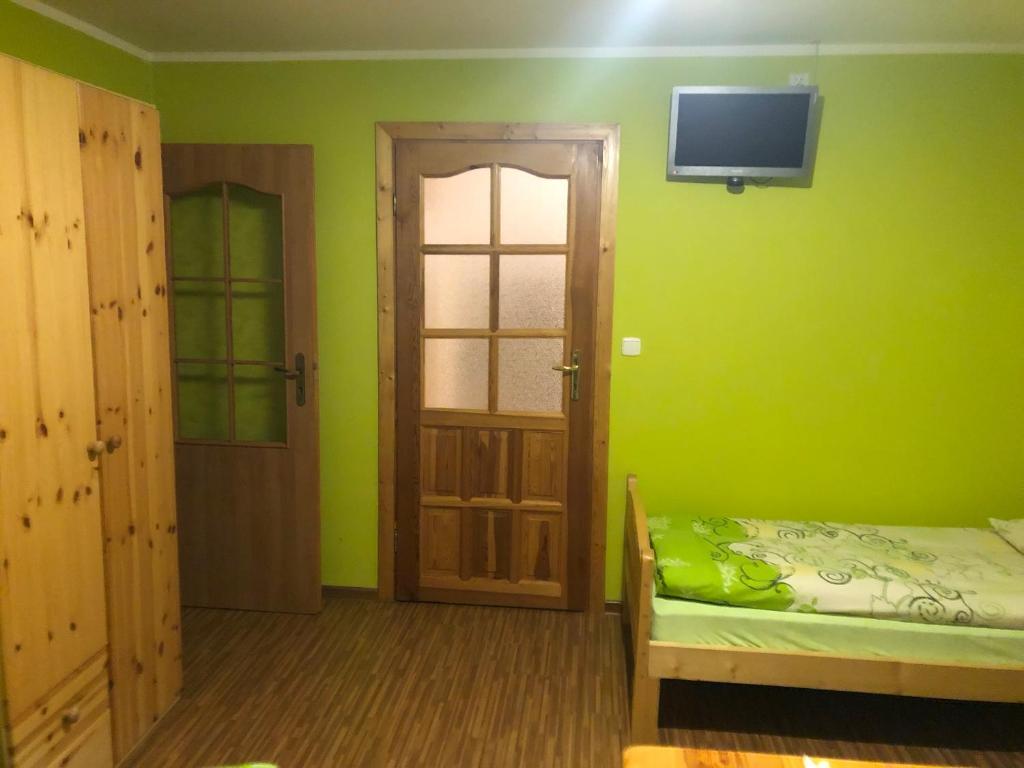 Posteľ alebo postele v izbe v ubytovaní Pokoje Gościnne Pod Gubałówką