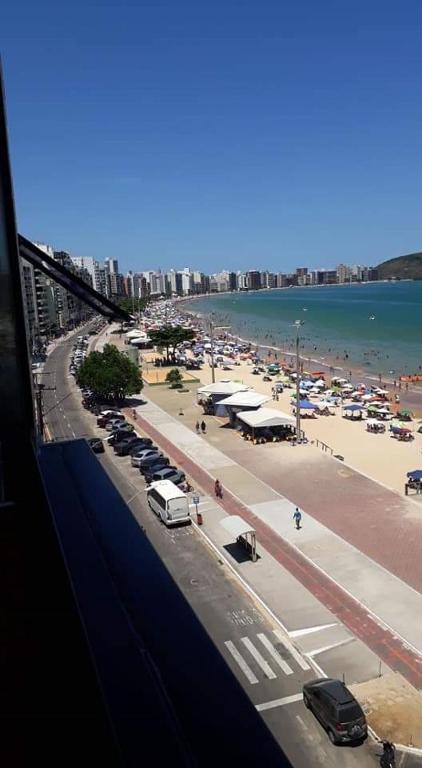 a view of a beach with cars parked at Casa Guarapari - Ferienhaus in Guarapari