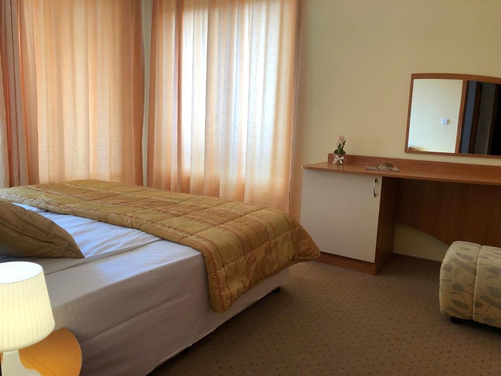 A bed or beds in a room at Beatris Family House
