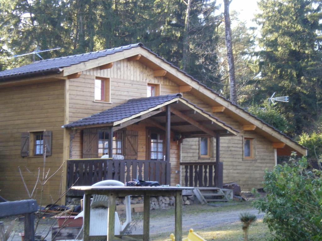 a small log cabin with a porch and a porch at Les Marmottes in Excénevex