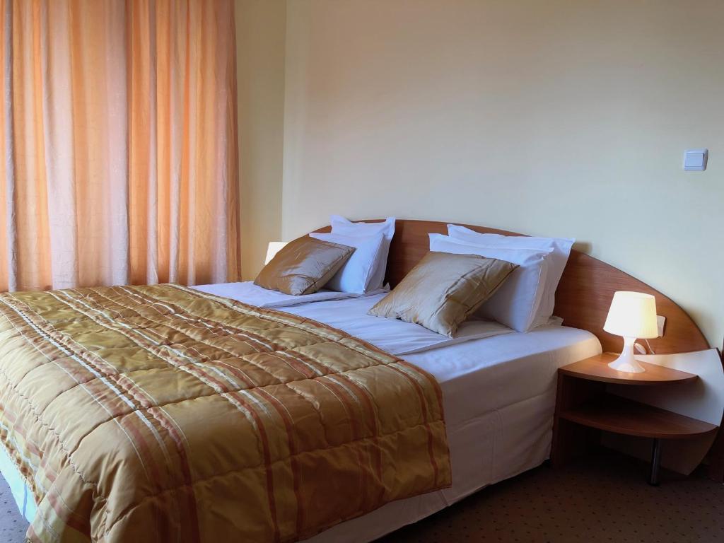 A bed or beds in a room at Beatris Family House