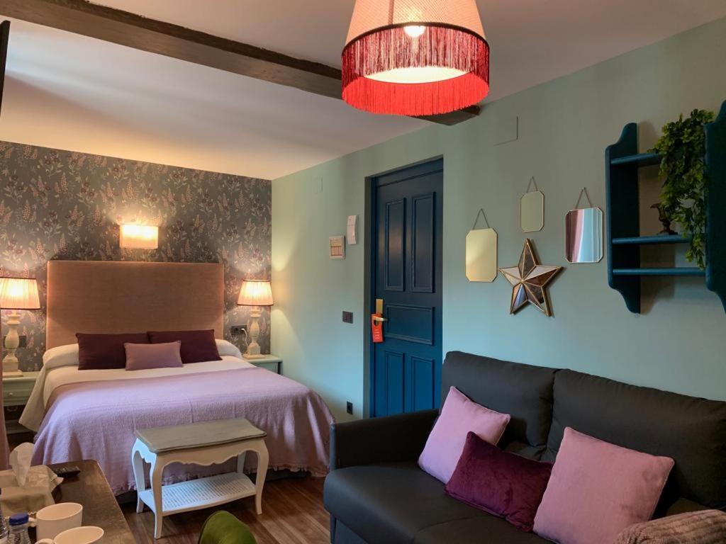 Postel nebo postele na pokoji v ubytování Hotel Boutique Balaitus