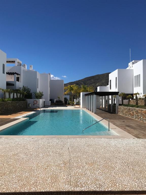 a large swimming pool in front of a building at Casa del Mar in Mojácar