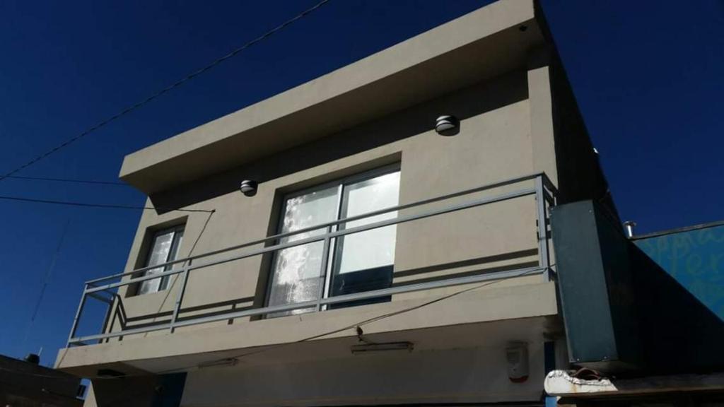 a balcony on the side of a house at ALQUILER TEMPORARIO VILLA UNION in Villa Unión