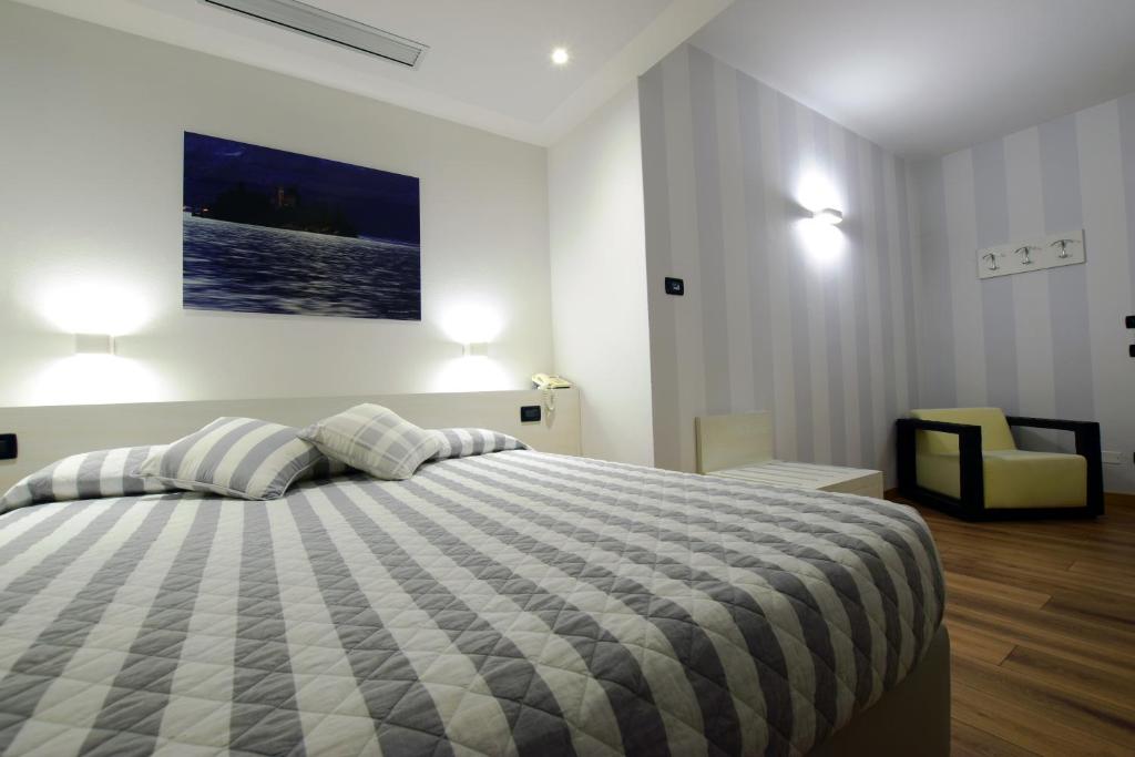 Postel nebo postele na pokoji v ubytování Albergo Ristorante Orazio