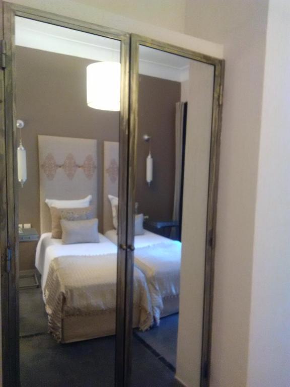 Postel nebo postele na pokoji v ubytování Riad Tchina