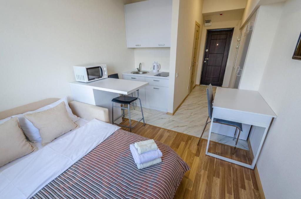 TV a/nebo společenská místnost v ubytování Home Inn