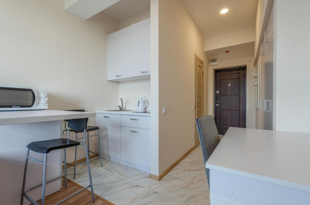Kuchyň nebo kuchyňský kout v ubytování Home Inn