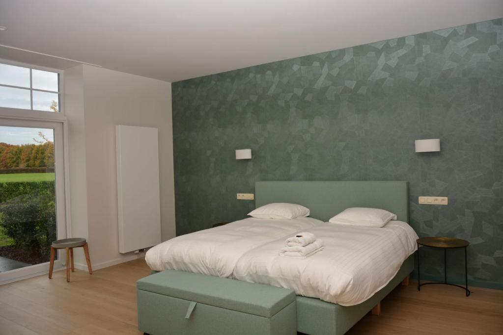 Postel nebo postele na pokoji v ubytování Hotel B - Boskapelhoeve