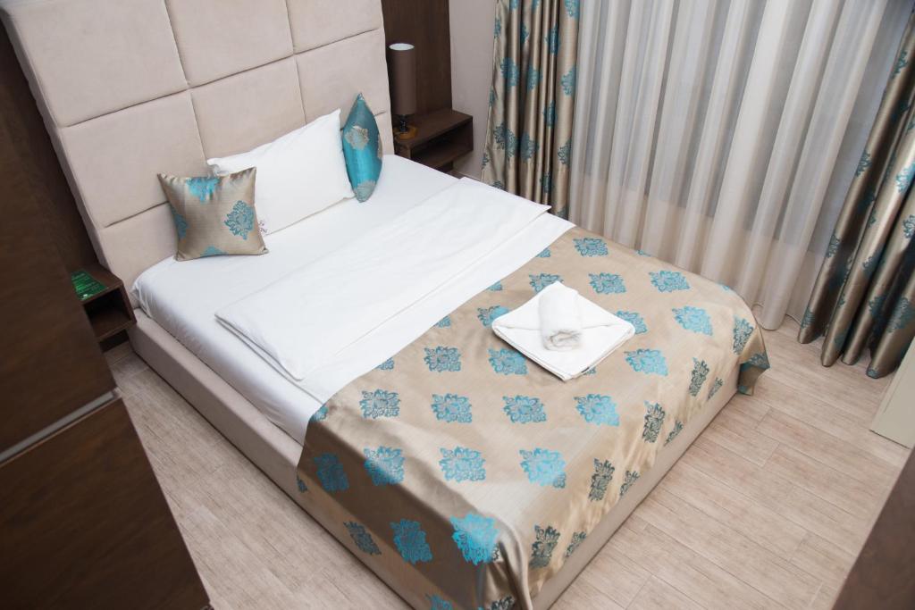 Postel nebo postele na pokoji v ubytování Hotel Crystal