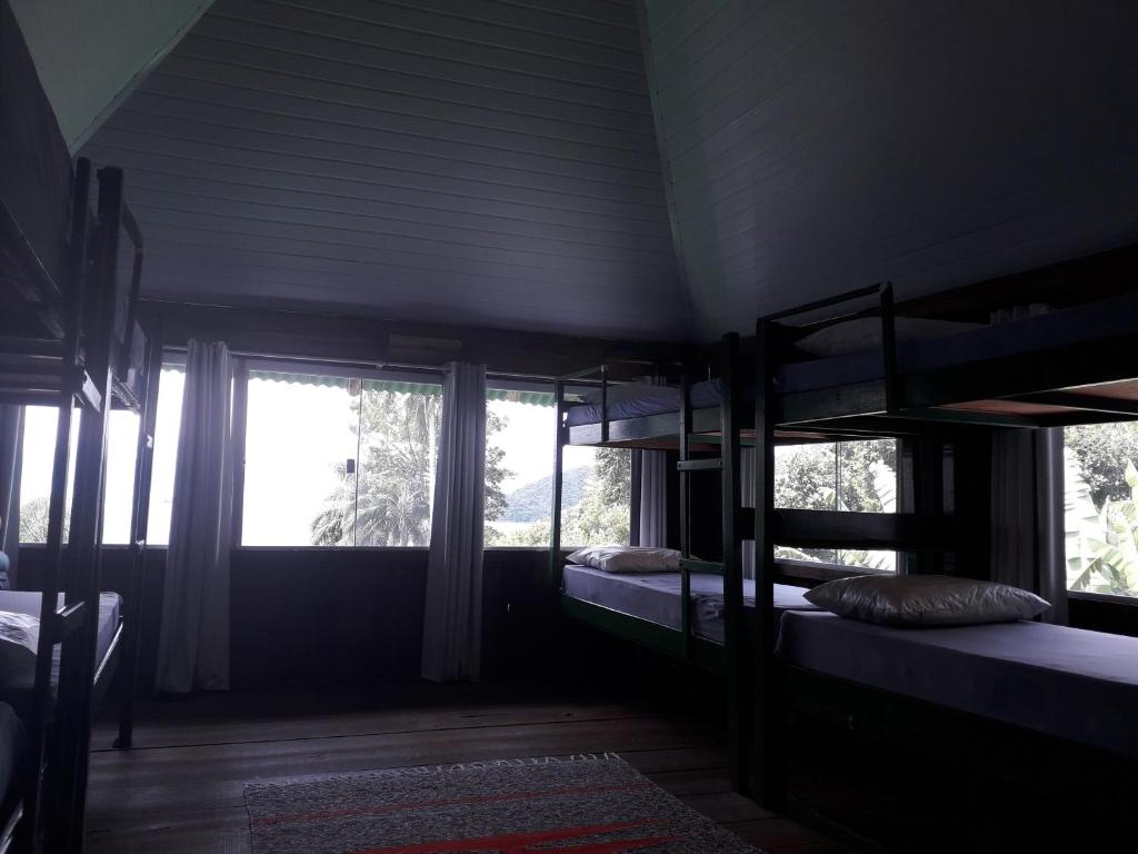 Postel nebo postele na pokoji v ubytování Hospedagem ocean view ilha g