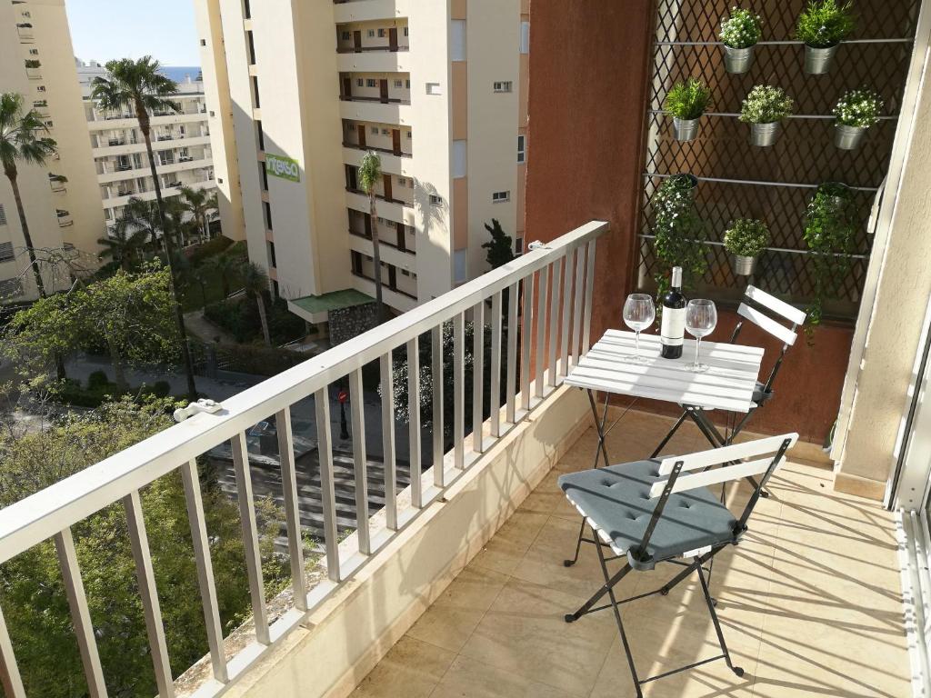 a balcony with a table and chairs on it at Mariana & Sirus´ Home in Marbella