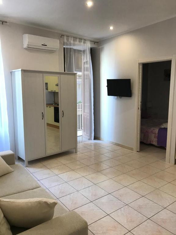 Televízia a/alebo spoločenská miestnosť v ubytovaní La Fonte Di Ortigia