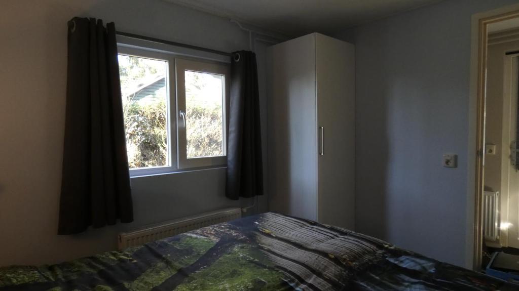 Postel nebo postele na pokoji v ubytování Poort van de Veluwe