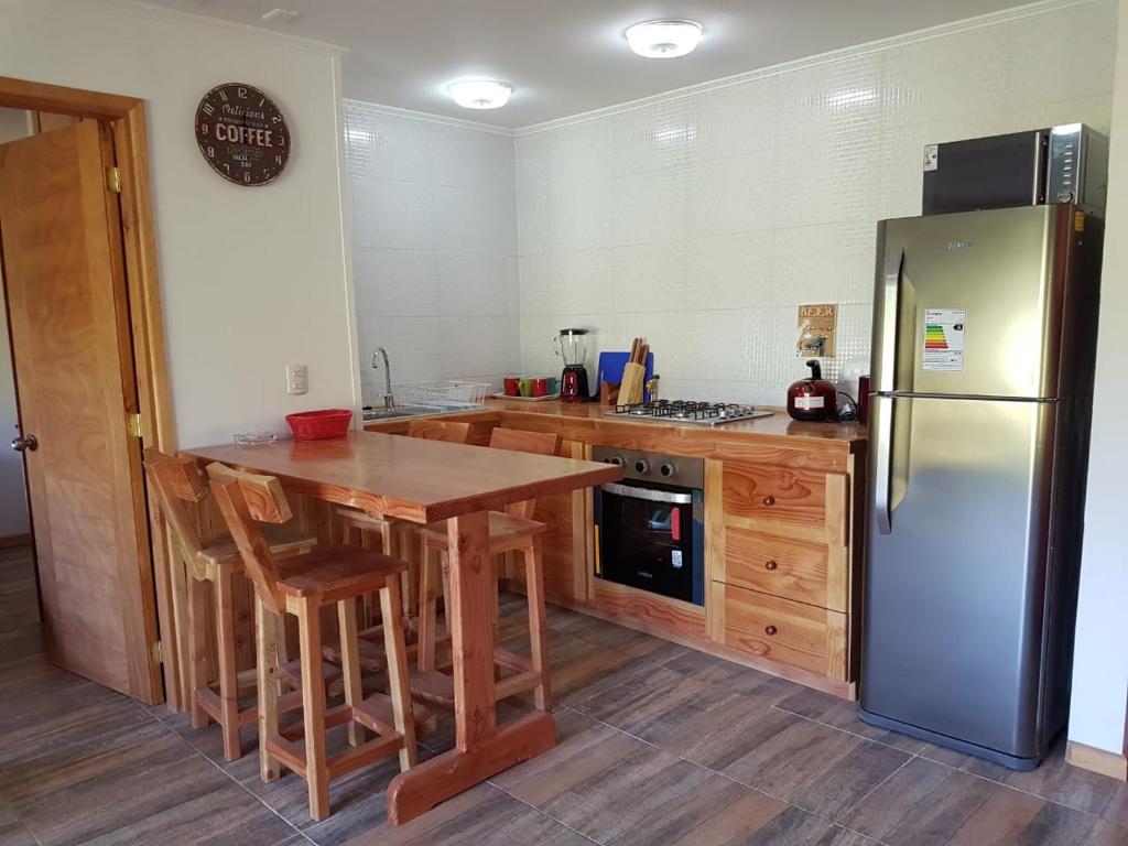 Kuchyň nebo kuchyňský kout v ubytování Terra Newen Pucon Family Suites