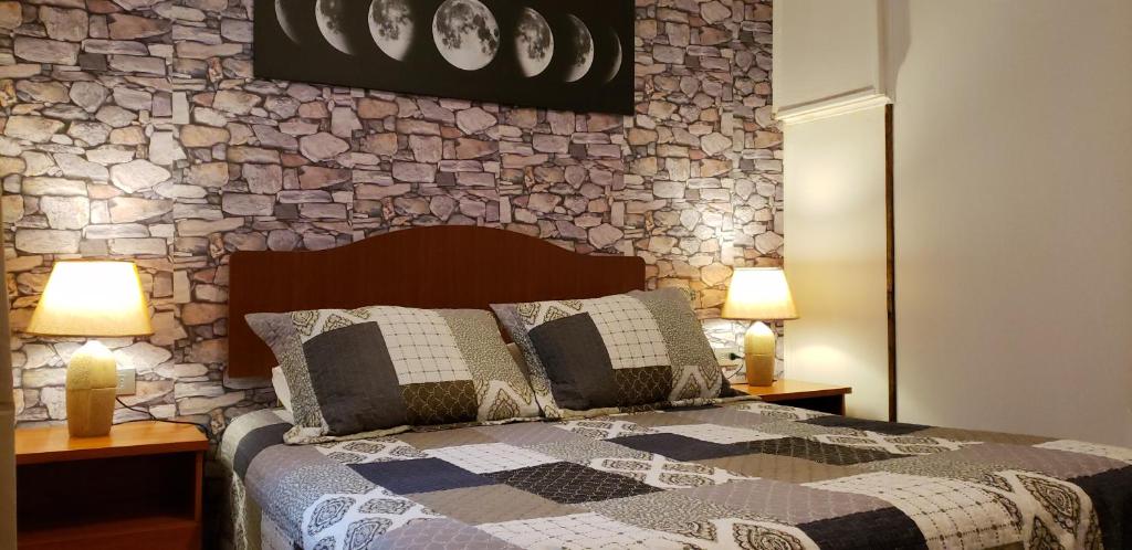 Hostal Torres del Paine 2にあるベッド