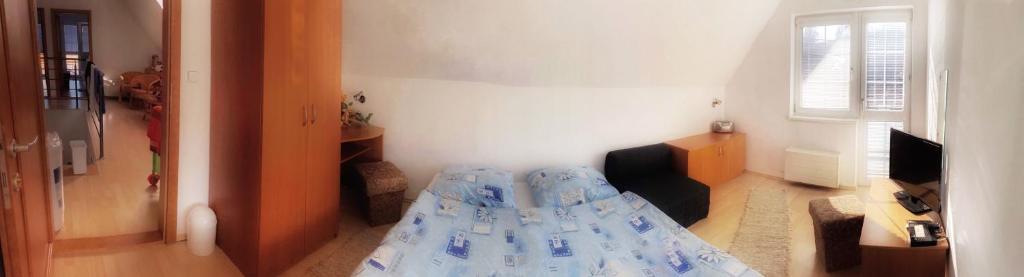Postel nebo postele na pokoji v ubytování Rekreačný Dom Sablatura