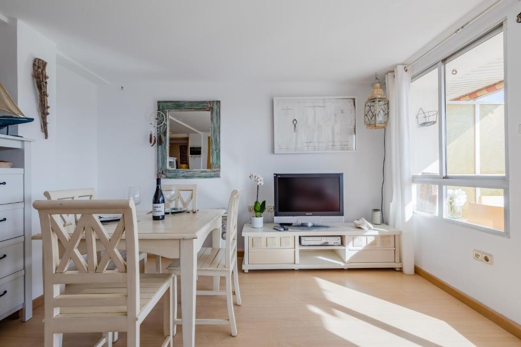 TV a/nebo společenská místnost v ubytování Apartamento Calipso