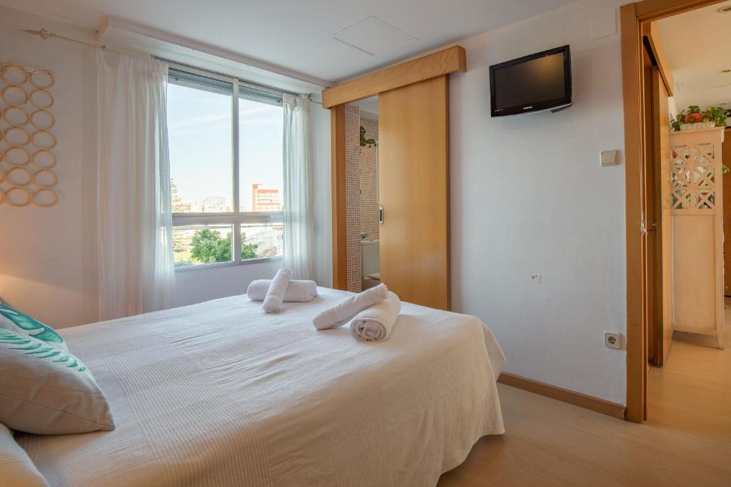 Postel nebo postele na pokoji v ubytování Apartamento Calipso