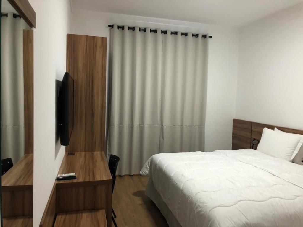 Un pat sau paturi într-o cameră la Hotel Matrix