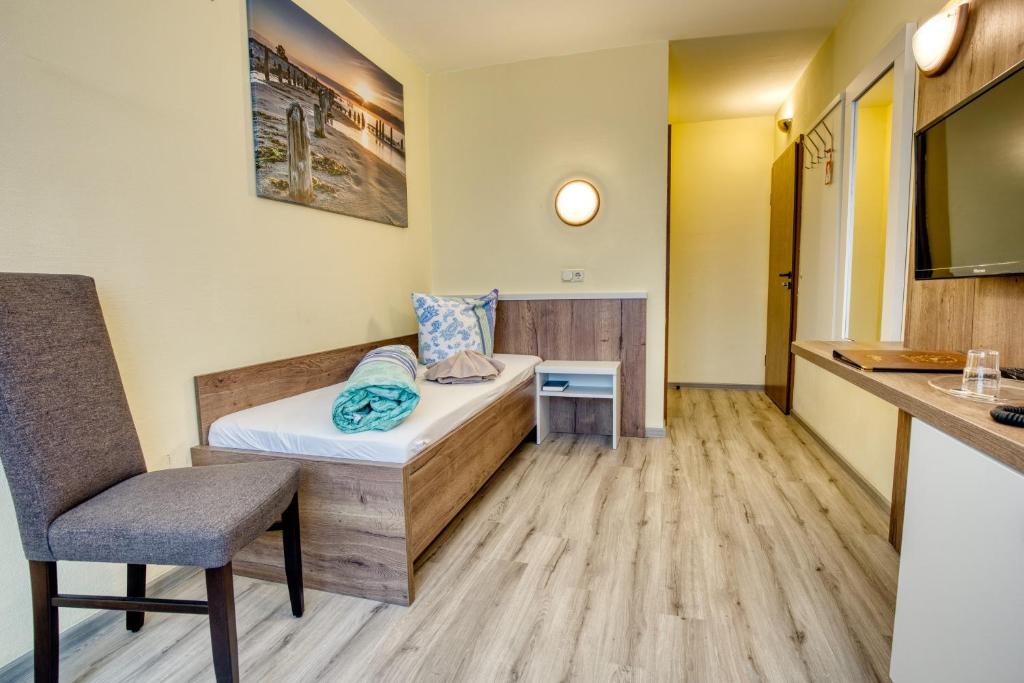 Postel nebo postele na pokoji v ubytování Hotel Kiebitz an der Ostsee