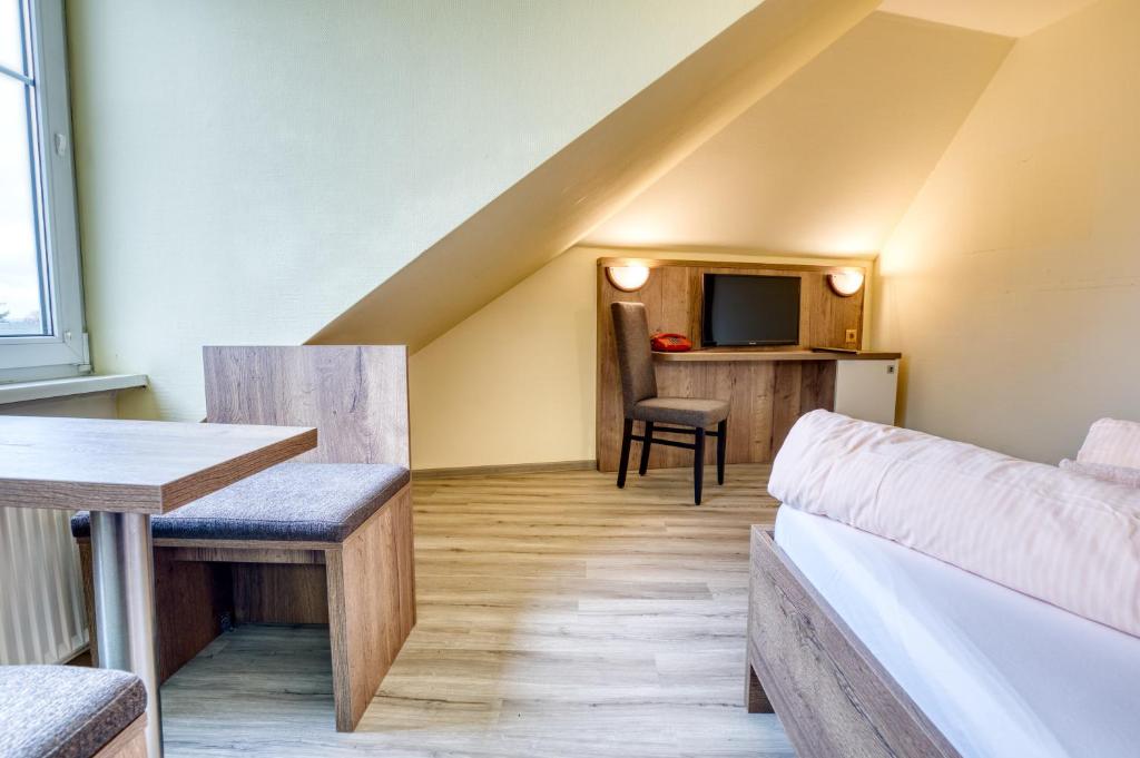 Postel nebo postele na pokoji v ubytování Hotel Kiebitz an der Ostsee