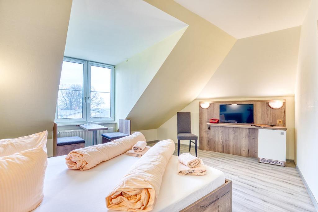 Postel nebo postele na pokoji v ubytování Hotel Kiebitz an der Ostsee