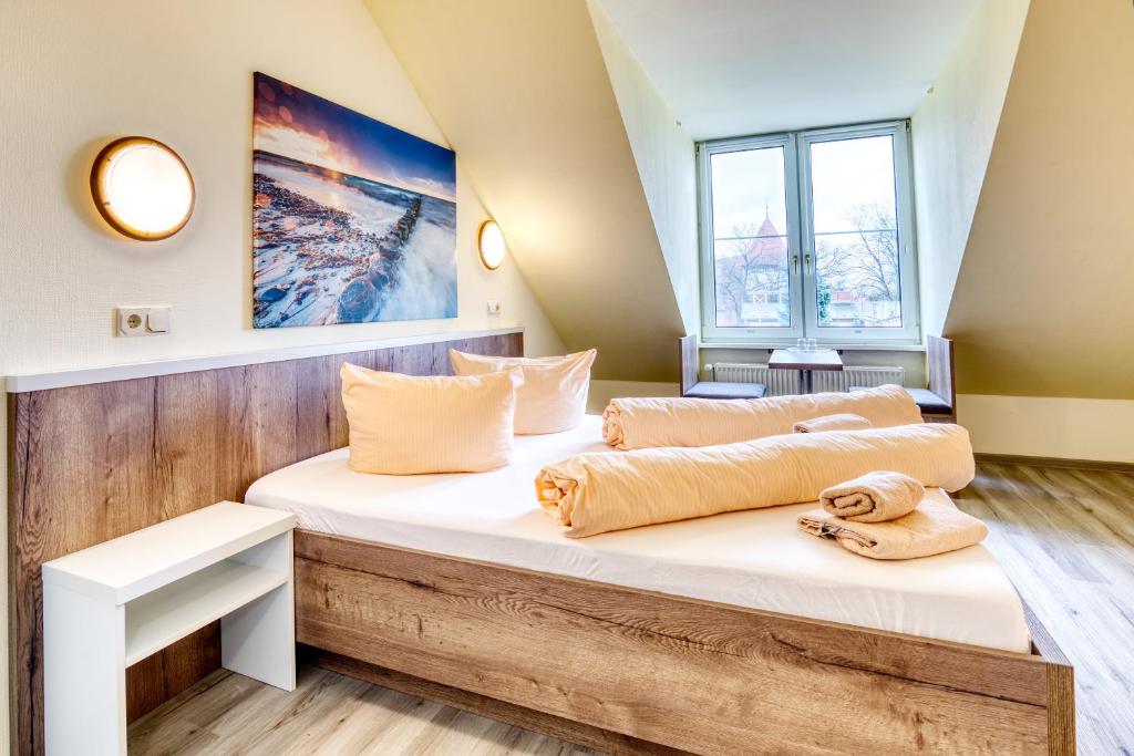 Postel nebo postele na pokoji v ubytování Hotel Kiebitz an der Ostsee