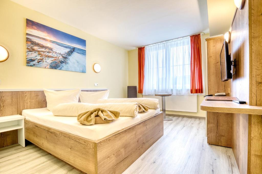 Postel nebo postele na pokoji v ubytování Hotel Kiebitz an der Ostsee