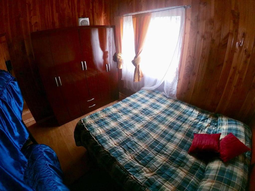 Postel nebo postele na pokoji v ubytování Hostal Maitahue