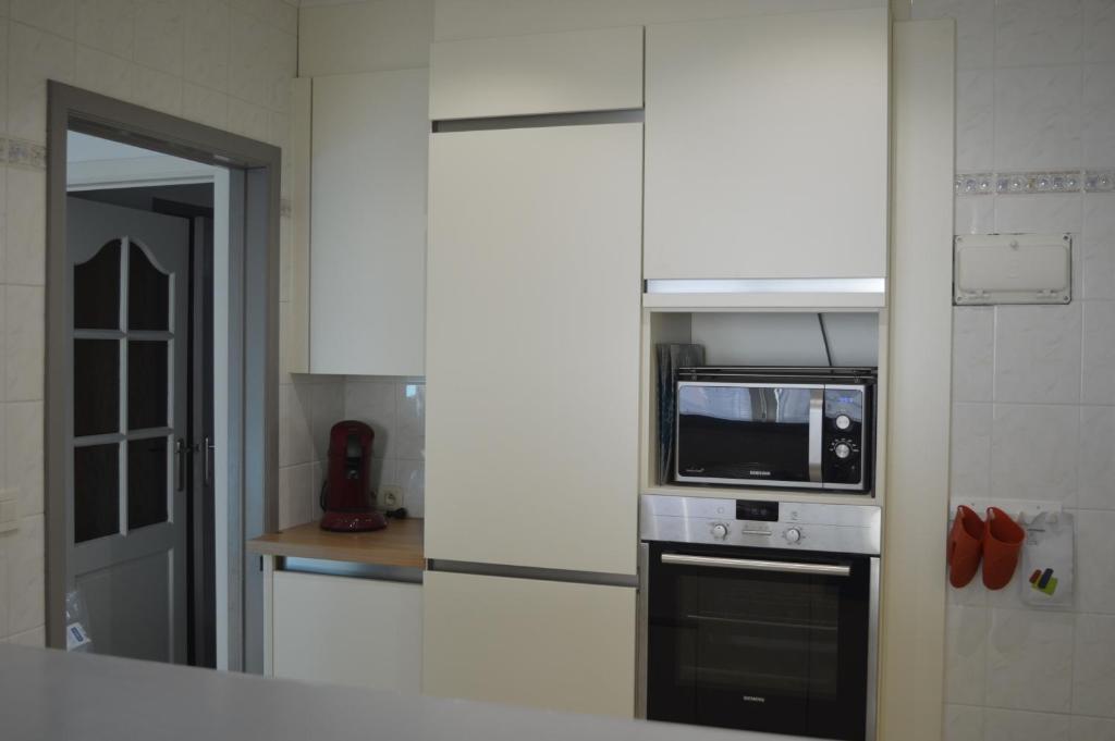 Kuchyň nebo kuchyňský kout v ubytování Residentie Paola
