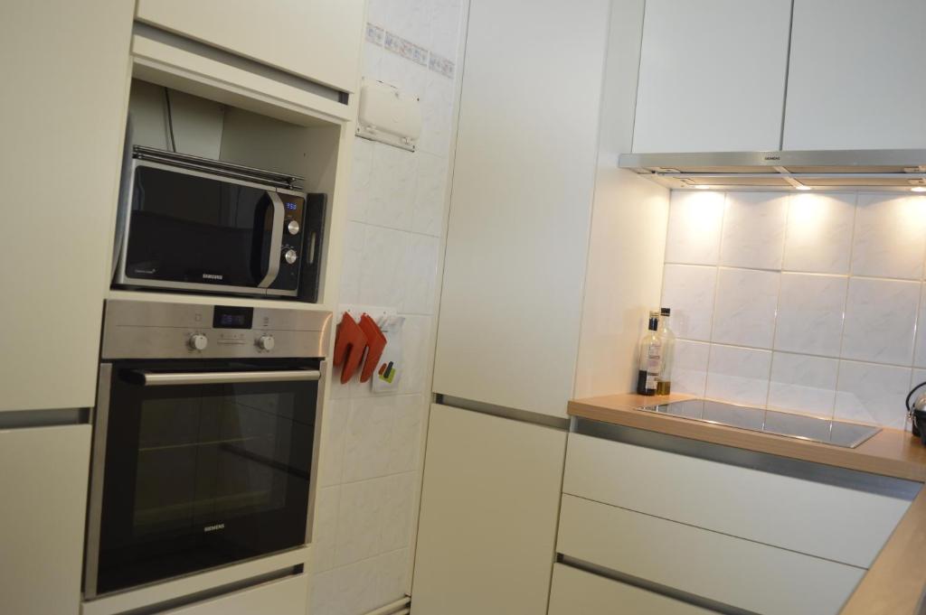 Kuchyň nebo kuchyňský kout v ubytování Residentie Paola