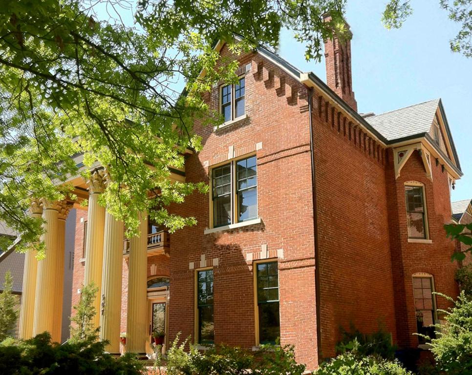 a large red brick building with a tower on top at Lyndon House Bed & Breakfast in Lexington