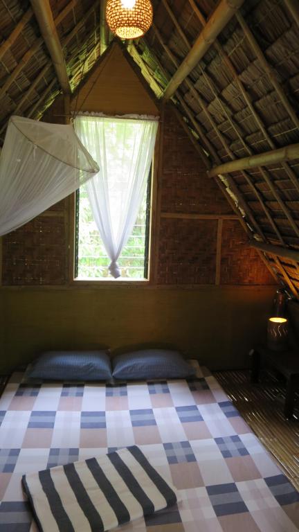 Ein Bett oder Betten in einem Zimmer der Unterkunft Lazy Lizard Hostel
