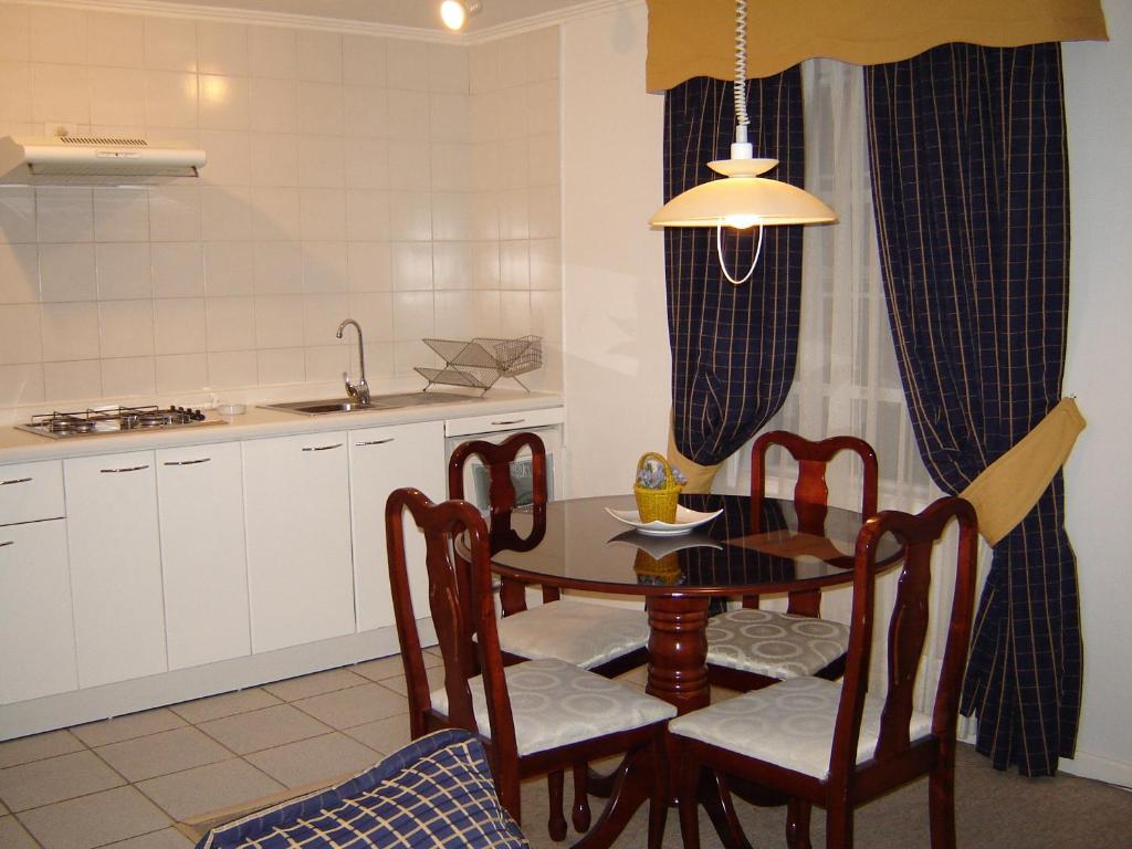 Kuchyň nebo kuchyňský kout v ubytování Apart Hotel Casablanca