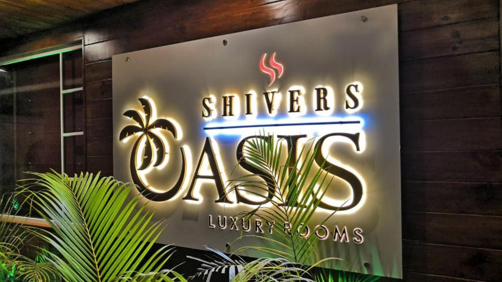 a sign for a singaporeans algas nightclub at Shivers Oasis Luxury Boutique Resort in Candolim