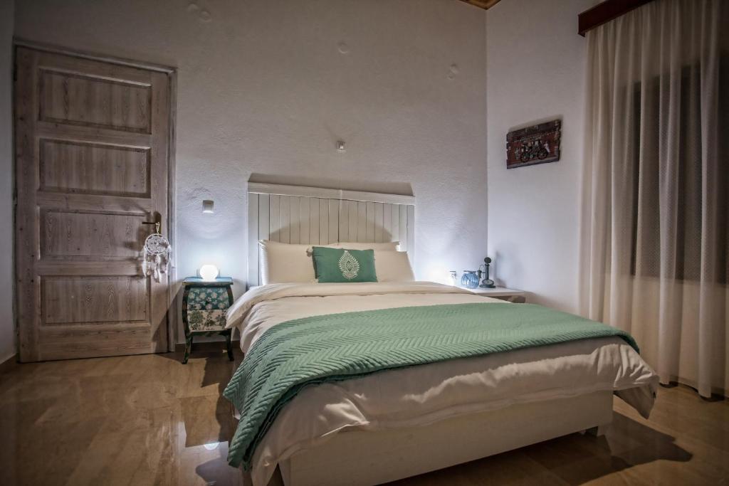 Posteľ alebo postele v izbe v ubytovaní Maya's Boutique Residence