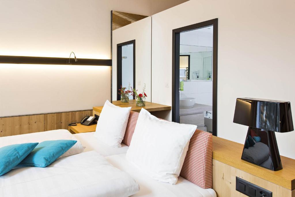 Postel nebo postele na pokoji v ubytování Hotel Palü