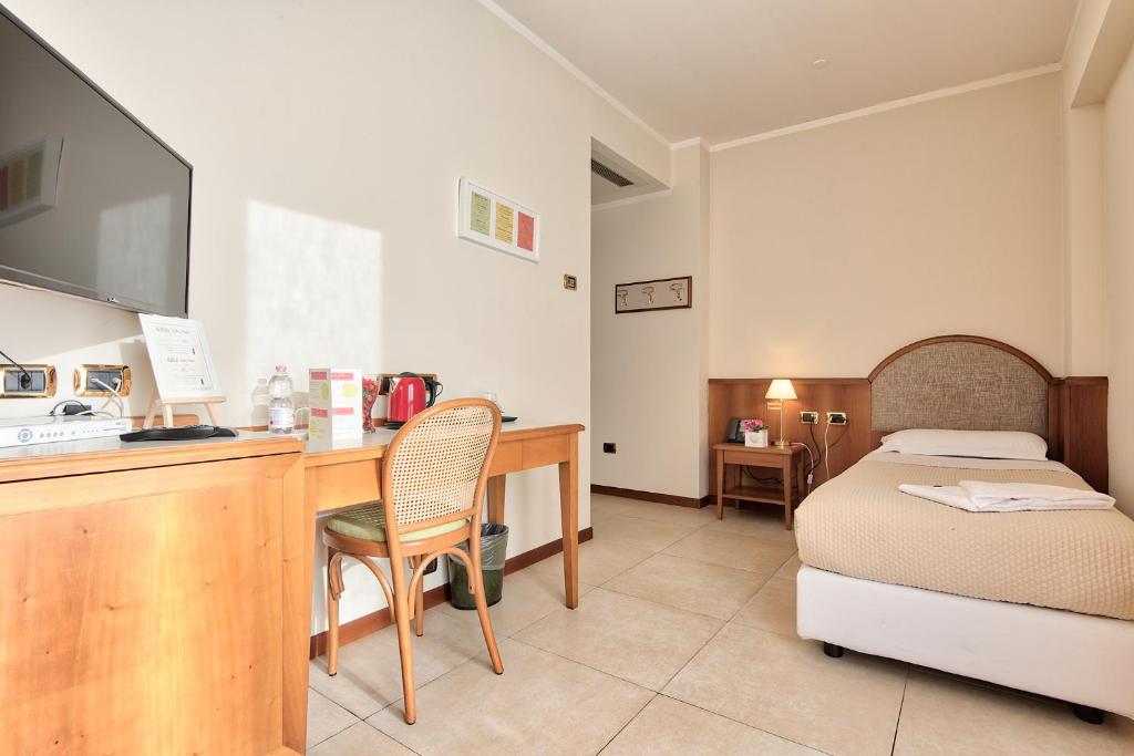 Posteľ alebo postele v izbe v ubytovaní Albergo Villa Priula