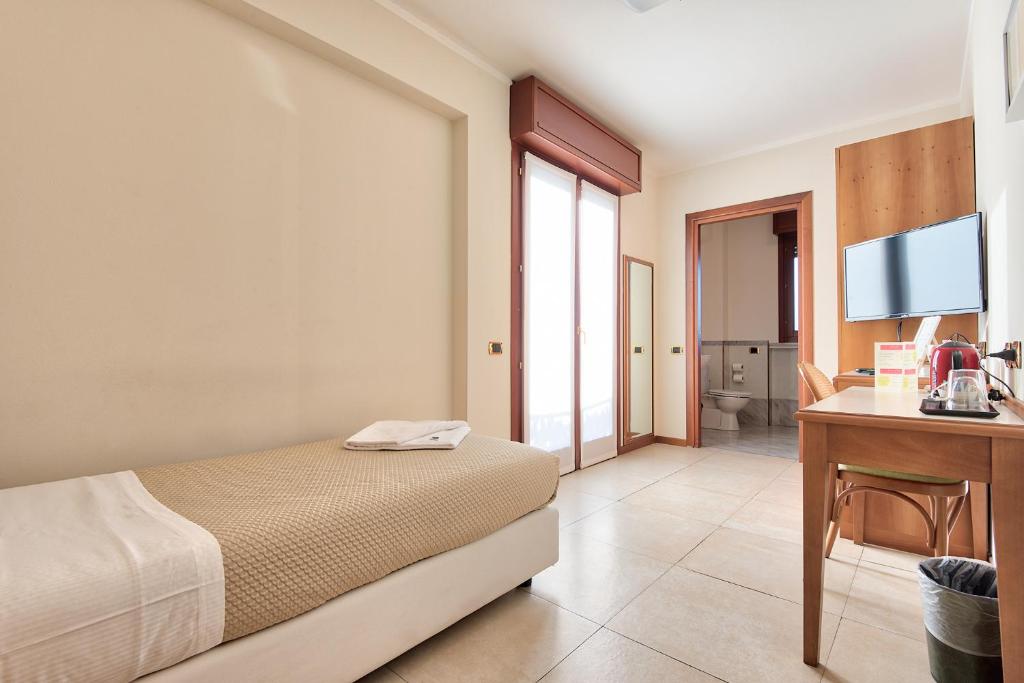 Posteľ alebo postele v izbe v ubytovaní Albergo Villa Priula